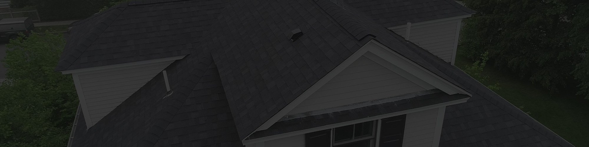 Newly repaired residential asphalt roof in New Bedford, Massachusetts