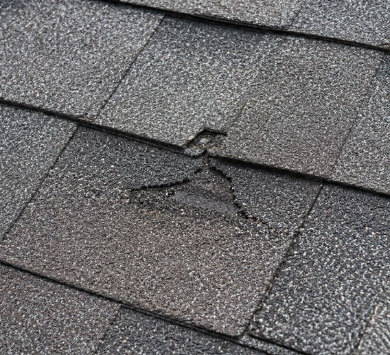 inspecting roofing surface